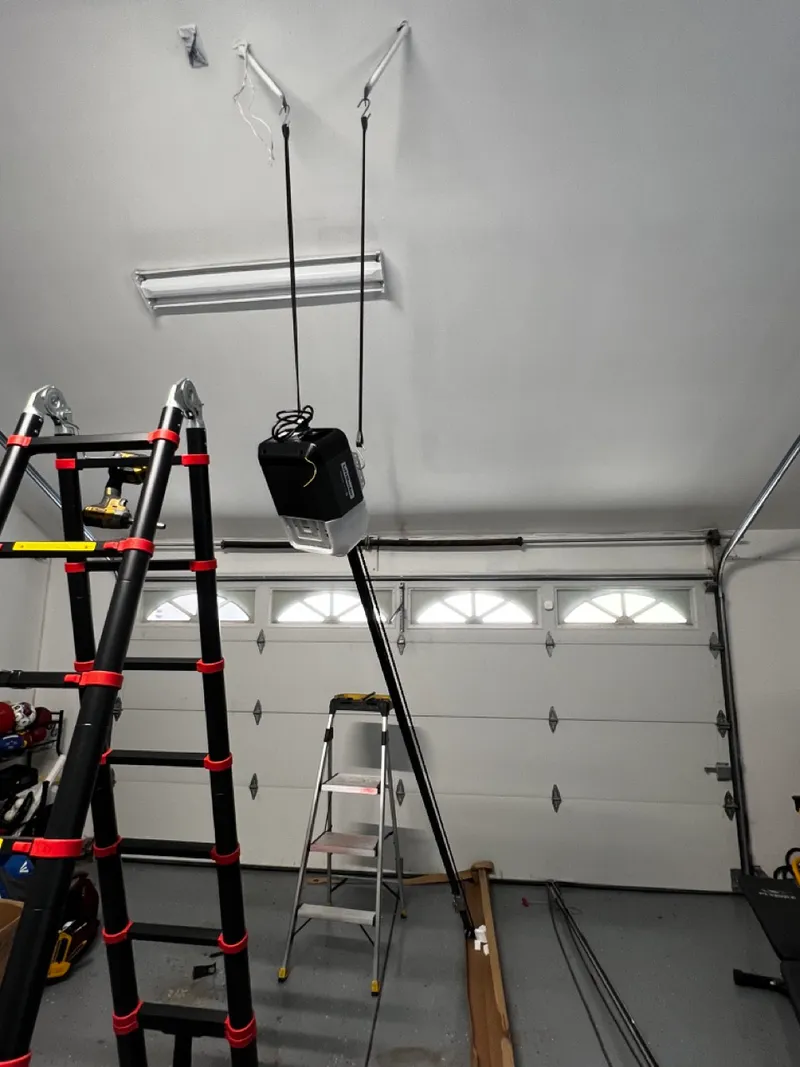 New garage door opener being installed